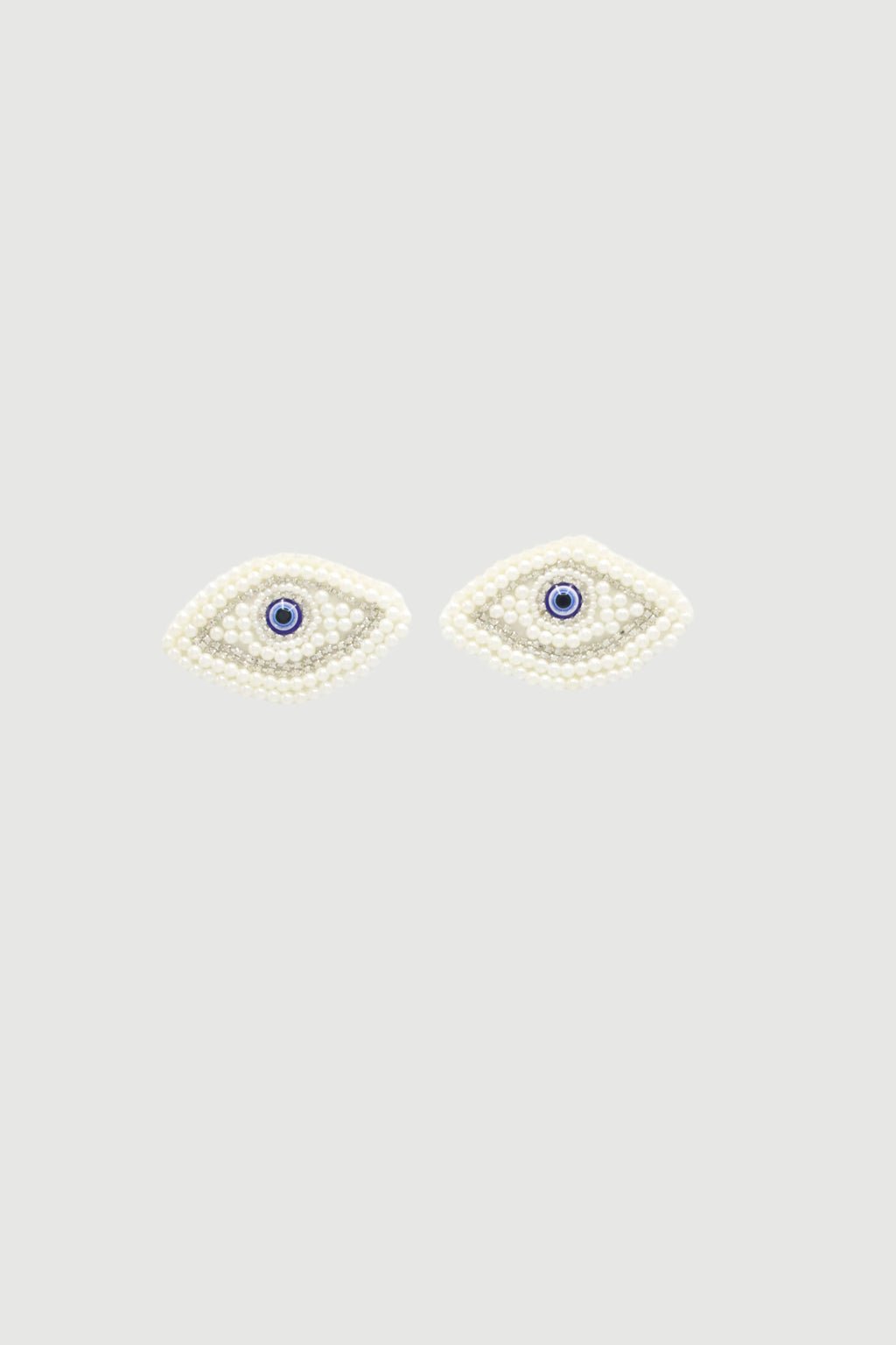 WHITE EYES BROOCH